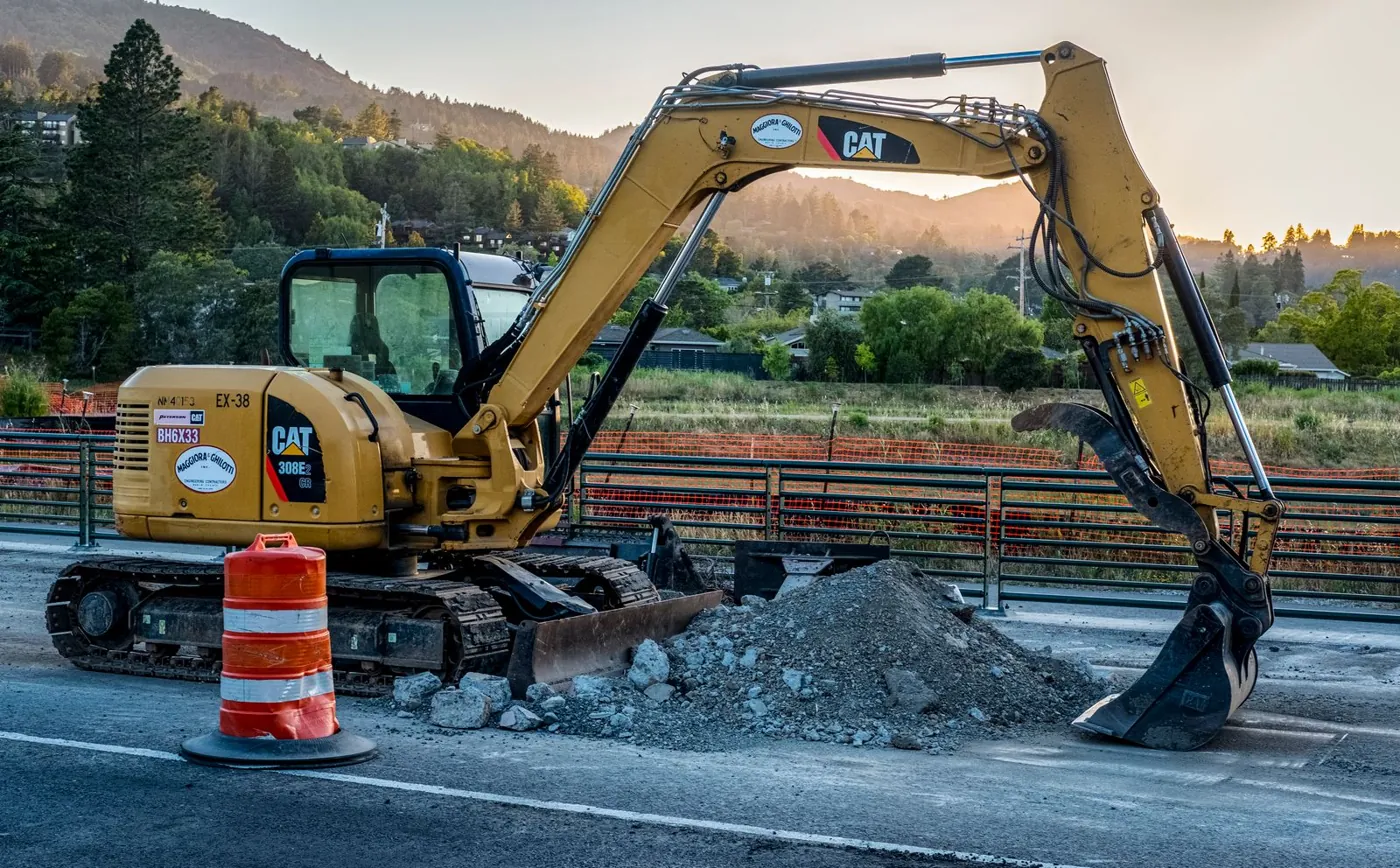 Caterpillar excavator on road works
